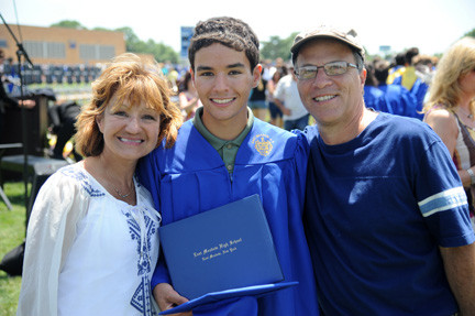 East Meadow graduate Aaron Roberts with mother Gina and father Neil.