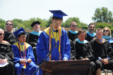 East Meadow High School salutatorian and class president Anson Wang addressed his peers during the graduation ceremony.  At left was valedictorian Neil Khosla, and at right, Superintendent Louis DeAngelo.