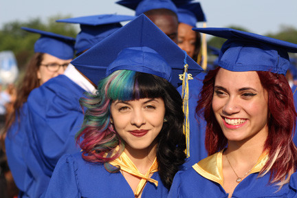 Melanie Martinez, a local talent who appeared on the Voice earlier this year, waited for her diploma with friend Kayla Martinez.