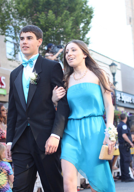 Gavin Dowd and Gaby Gerstman walk past family and friends.
