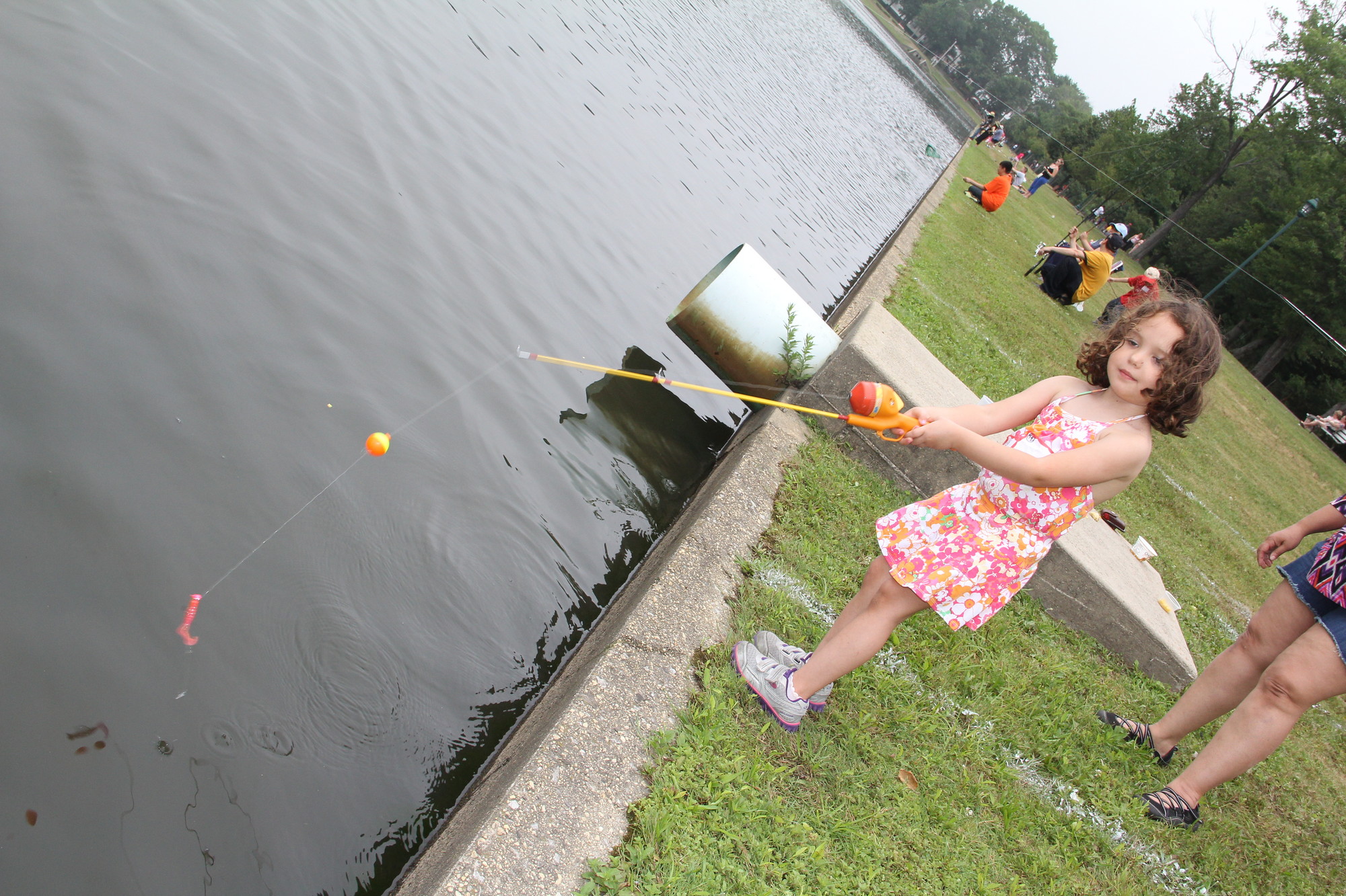 Charlotte Prial, 4, has a great time on her first fishing trip at Hendrickson Park last Sunday afternoon.