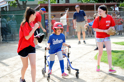 Julia Modico, 10, ran to first base with her buddies Abby Bruno, left, and Nicole Cummins.