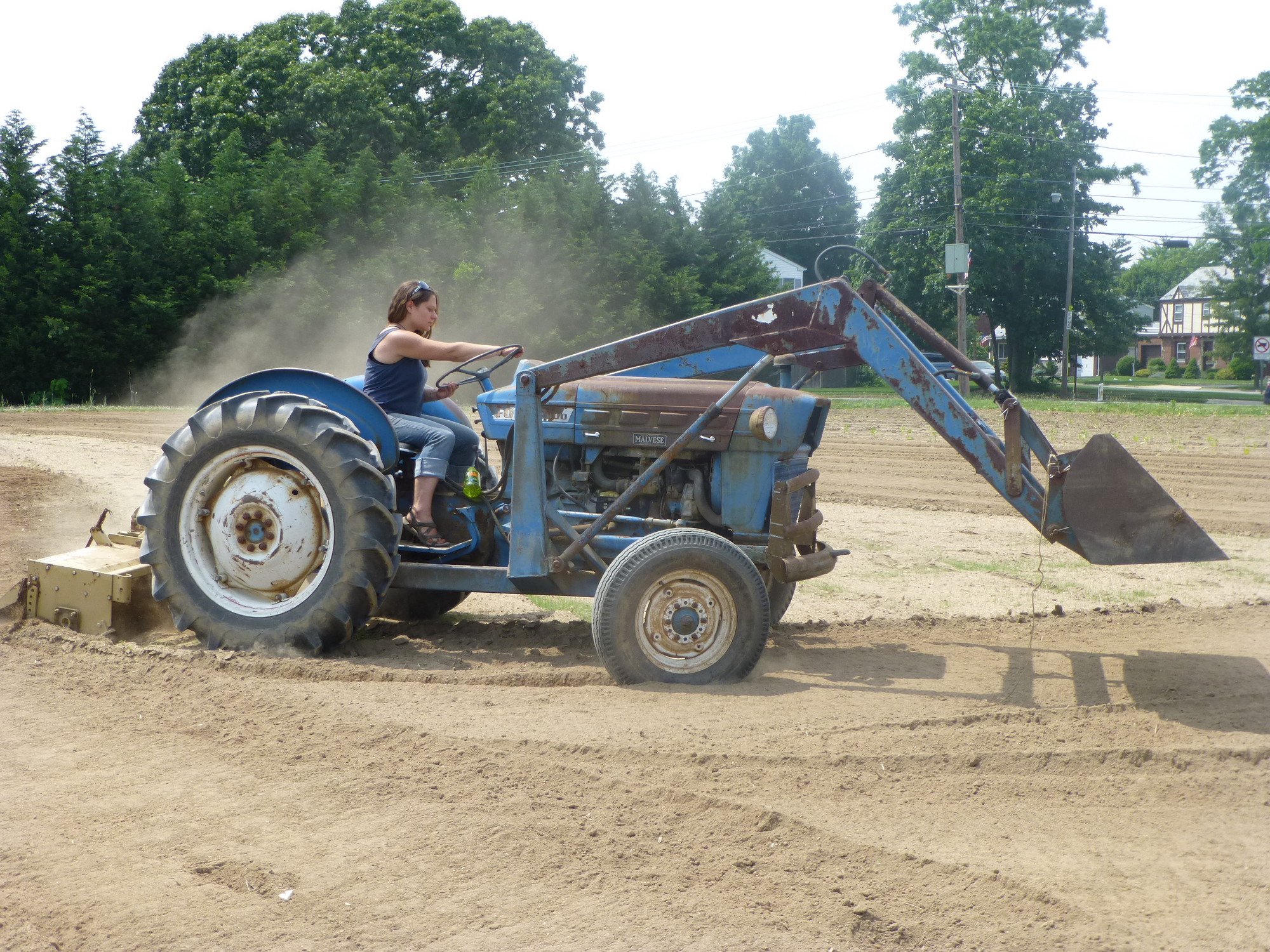 Crossroads Manager Elizabeth Schaefer tilled the fields on her tractor.