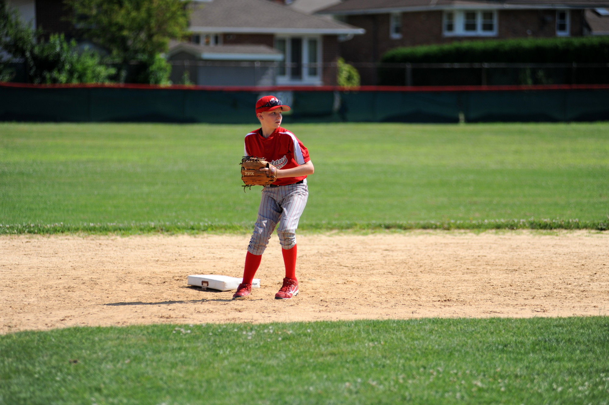 Brendan Turton fired a ball from shortstop during the baseball camp.