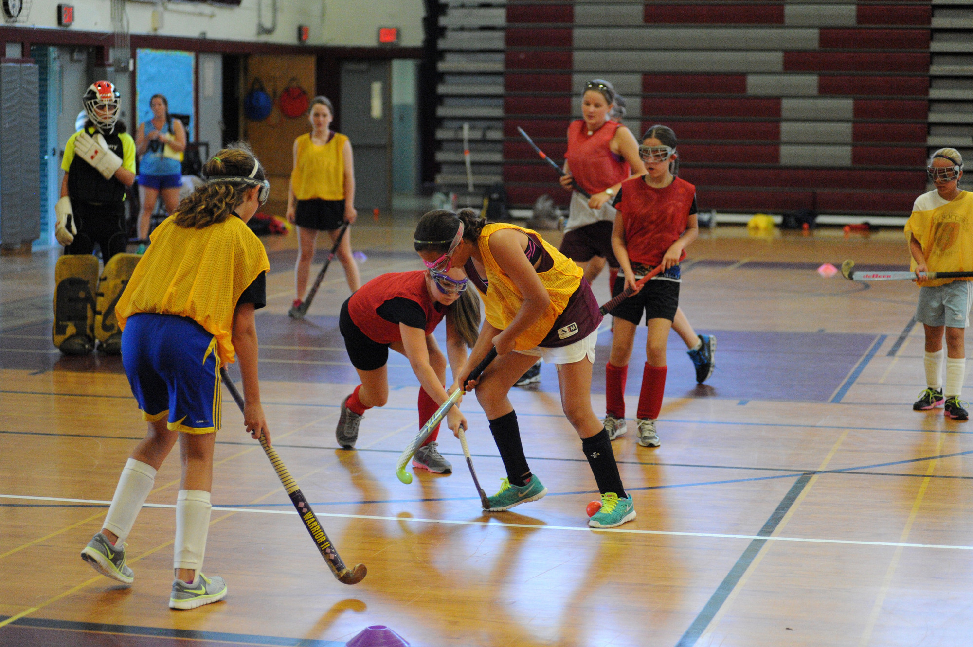Faith Coughlin and Gabriella Sferrazza battled for a loose ball in a game of field hockey, which has been played at Clarke High School since 1959.