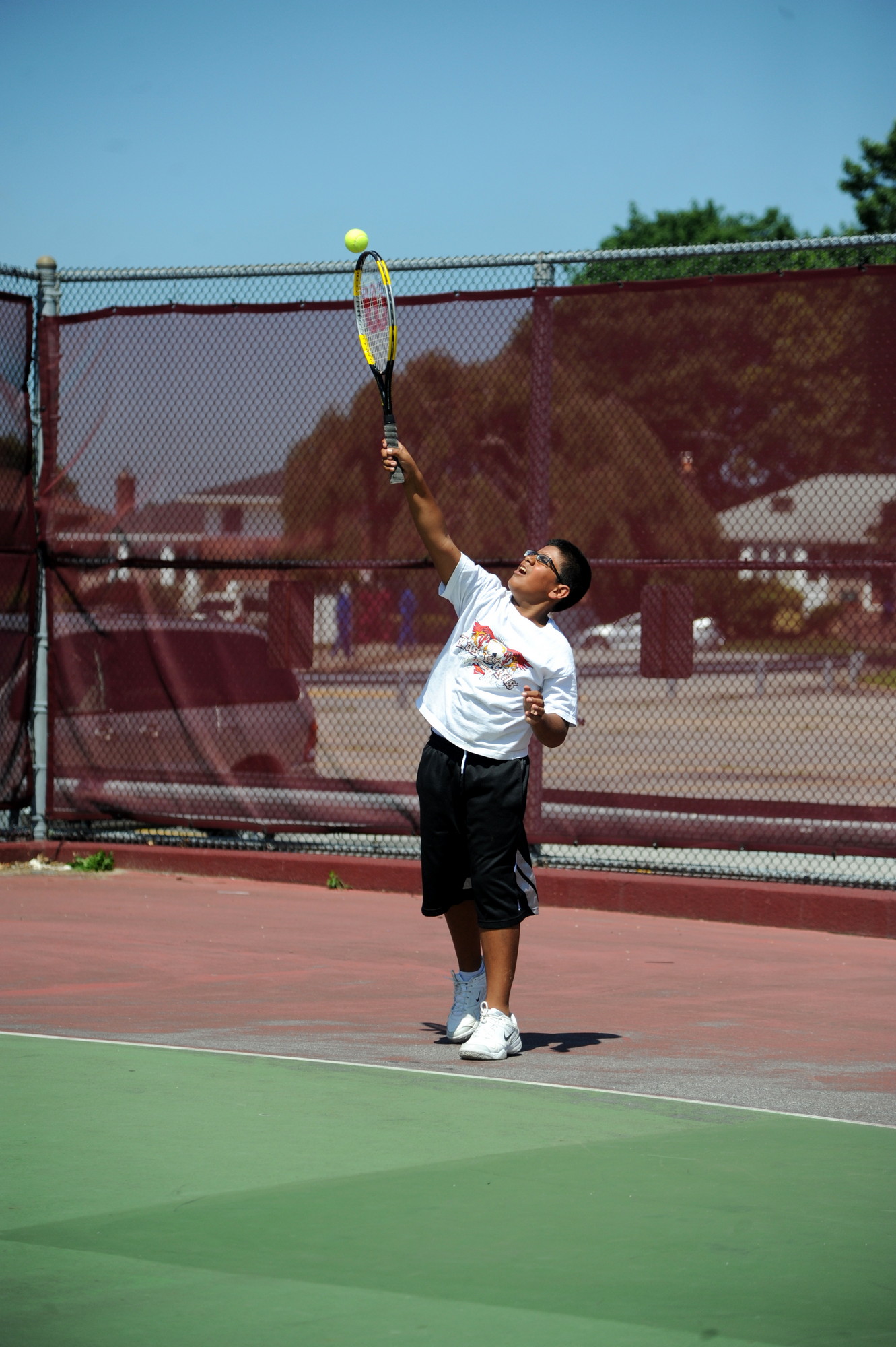 Ashique Hasany served during the tennis portion of East Meadow’s CAPE Summer Sports Program.