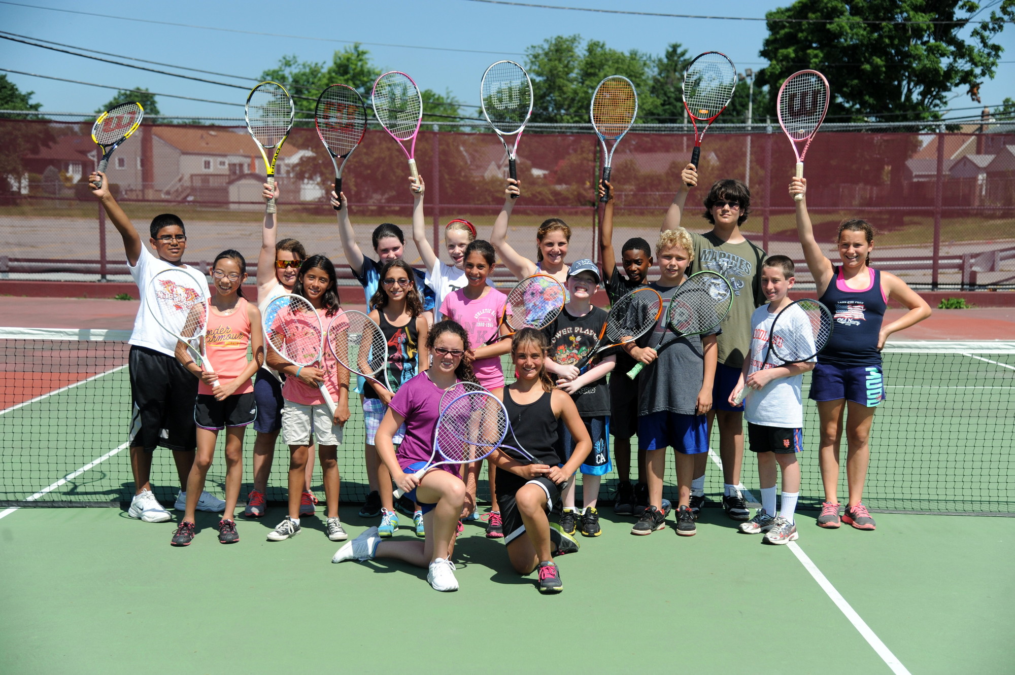 Rackets up! The East Meadow School District’s CAPE summer camps offer instruction in a variety of sports, including tennis.