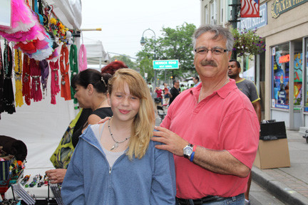 Todd Litz helped his daughter Madassin put on the new necklace he just bought for her.