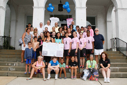 The Chalk Talk participants, along with village officials, posed for a picture on the steps of Village Hall. They will be back every Saturday this summer.