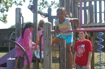 Participants in District 13's summer recreation program enjoy some quality time on the playground.