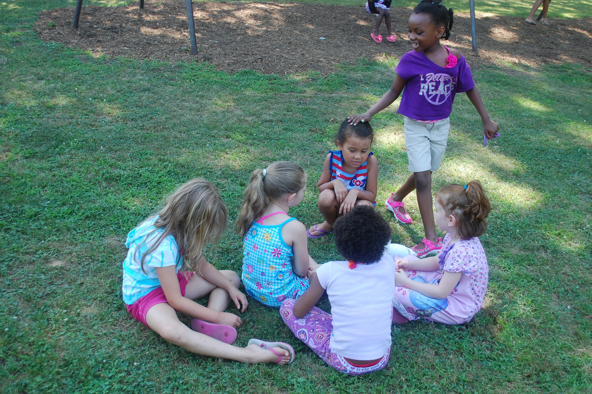 Children entertained themselves with a game of Duck, Duck, Goose.