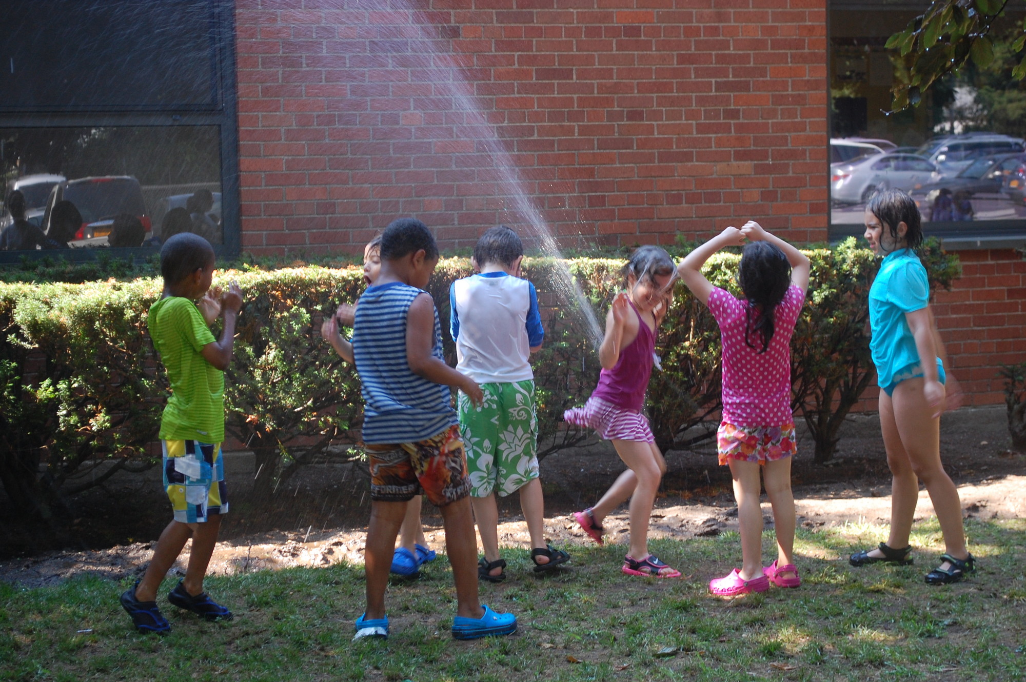On a hot July day, the sprinkler provided much needed refreshment.