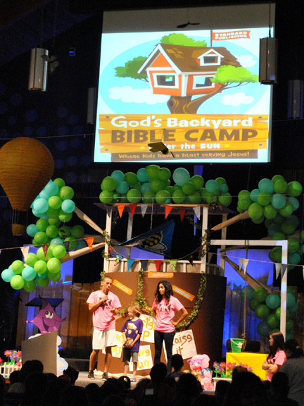 VBS committee members Johnathan and Jasmine Kerby introduce first-grader, Matthew, who donated his money to Mexican orphans.