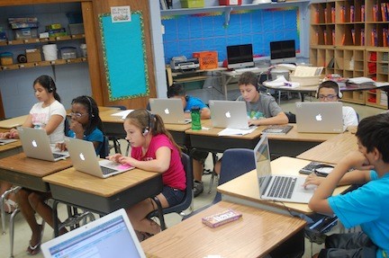 Sixth-grade students spend part of their day doing independent work on the computer at the Robert W. Carbonaro School.