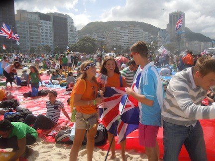 Lyndsey Ruchalski, center, and Jamie Roggio spoke to Sebastian, a boy from the UK, on the beach in Rio.