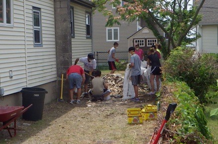 Teen missionaries from Next Step MInistries helped to clean up debris from the Casas’s side yard.