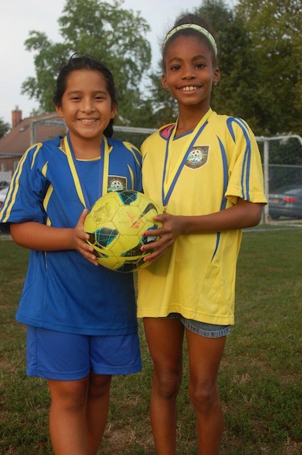 Jeralyn Castro, left, was named most valuable goalie while Nia Anjou was most valuable player for the 9-year-old Fuerza team which was undefeated under coach Rosie Fernandez.