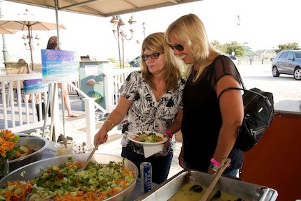 Judy Fahrenkrug and Melissa Hawxhurst tried the salad at the buffet table.