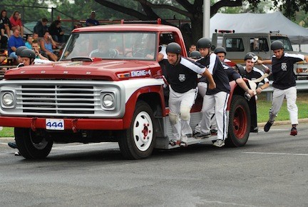 The Woodlanders prepared for a hasty exit from a moving pickup truck in the motor pump contest.