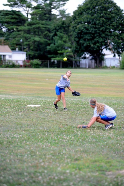 Shortstop Stefanie Botman, 12, fired the ball to first base as the team practiced double plays on the McVey Elementary School playing fields.