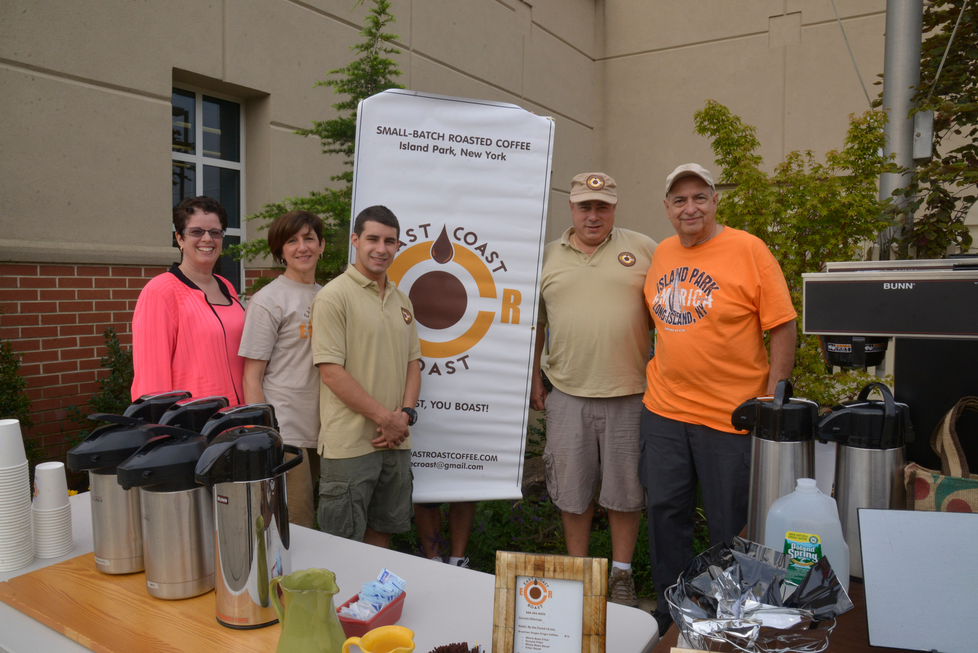 Library director Jessica Koenig (left), Richard Maryanne and John Comuniello  from East Coast Coffee, the company that donated coffee for the event, with library trustee Joe Ponte at the community welcome ceremony last week.