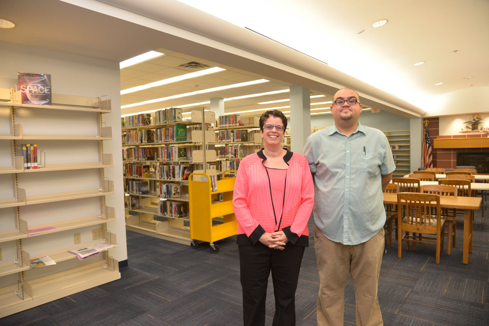 Library director Jessica Koenig and Antonio Cuneo, a library aide  who has worked at Library since he was 16.