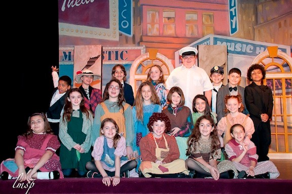 The cast during a performance of “Annie.”