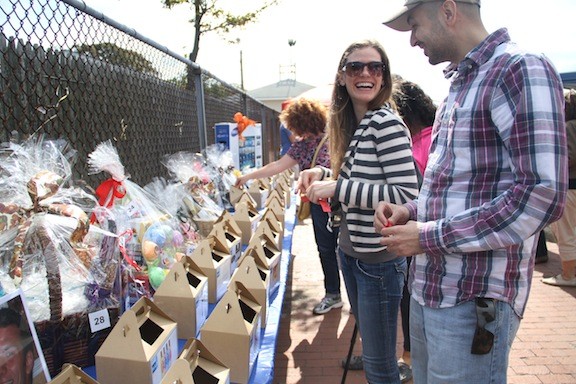 Andrea Leconte and Kamran Khan looked over the raffle baskets.