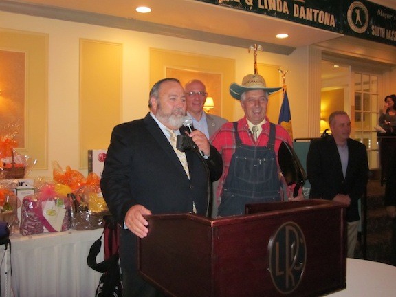 Mayor Francis Murray introduced honoree Robert Schenone, who surprised the mayor by entering dressed as a farmer as a nod to his gardening work.