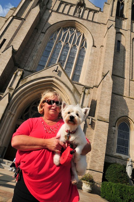 Kathy Horace and her West Highland Terrier Madeline waited to be blessed.
