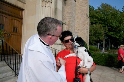 Father McHugh blessed Lorie Fusco and Oliver, the Japanese chin