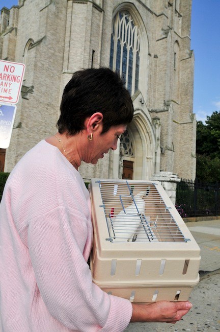 Pat Lichtman brought her Goffin Cockatoo Samantha to St. Agnes to be blessed.