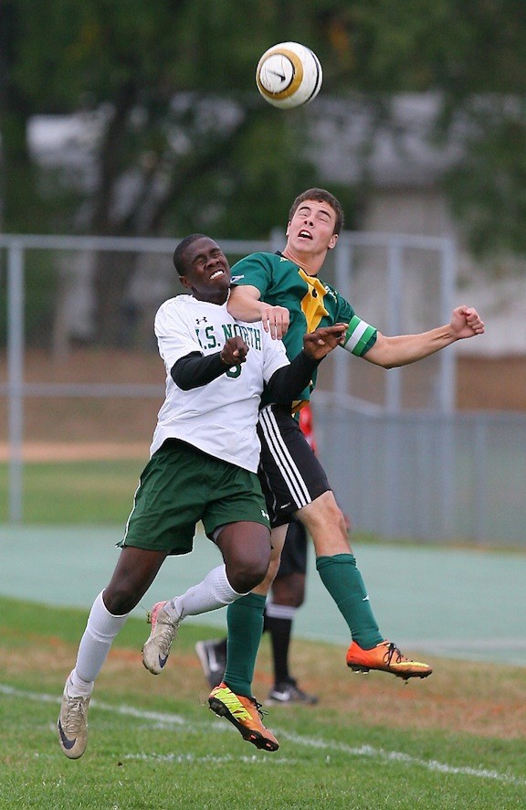 Lynbrook's Brendan Tedaldi, right, and Valley Stream North's Fritznel Pierre took to the air for control of the ball during last Friday's 1-1 tie.
