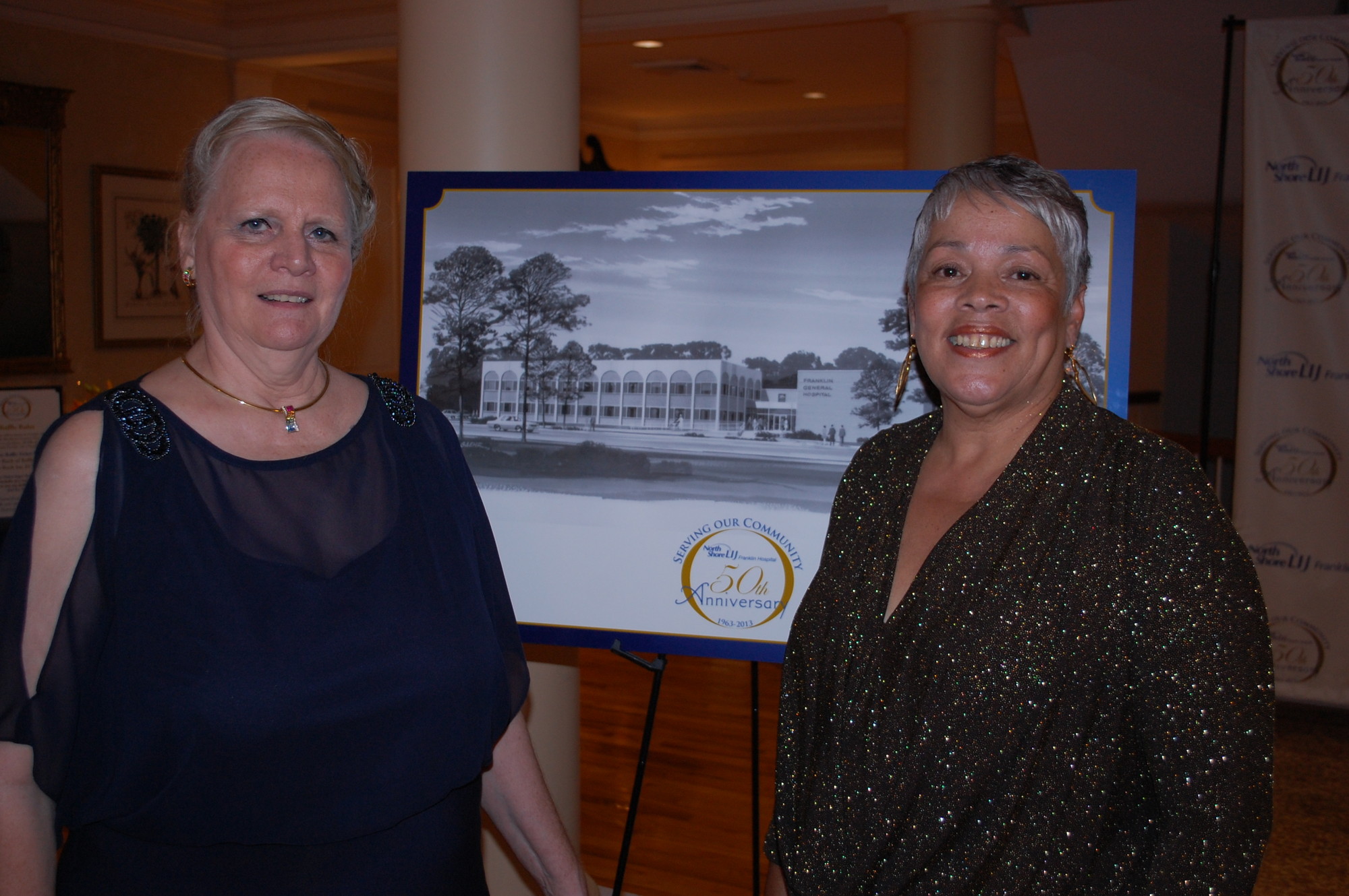 Franklin Executive Director Catherine Hottendorf, left, and Community Relations Manager Helen White greeted guests at the Woodmere Club.