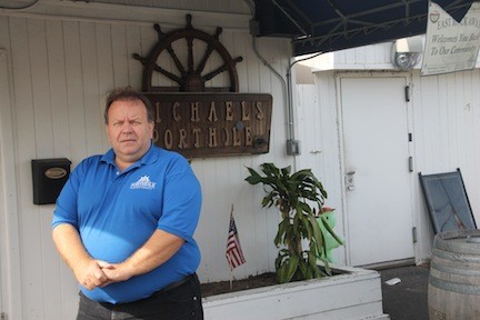 Porthole owner Michael Rodonis stands outside his Oceanside restaurant after the filming of
