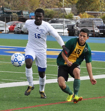 Lawrence's Wisdom Ezihie, left, worked against Lynbrook's Erik Vivar during last Friday's Class A playoff game won by the Golden Tornadoes, 1-0.