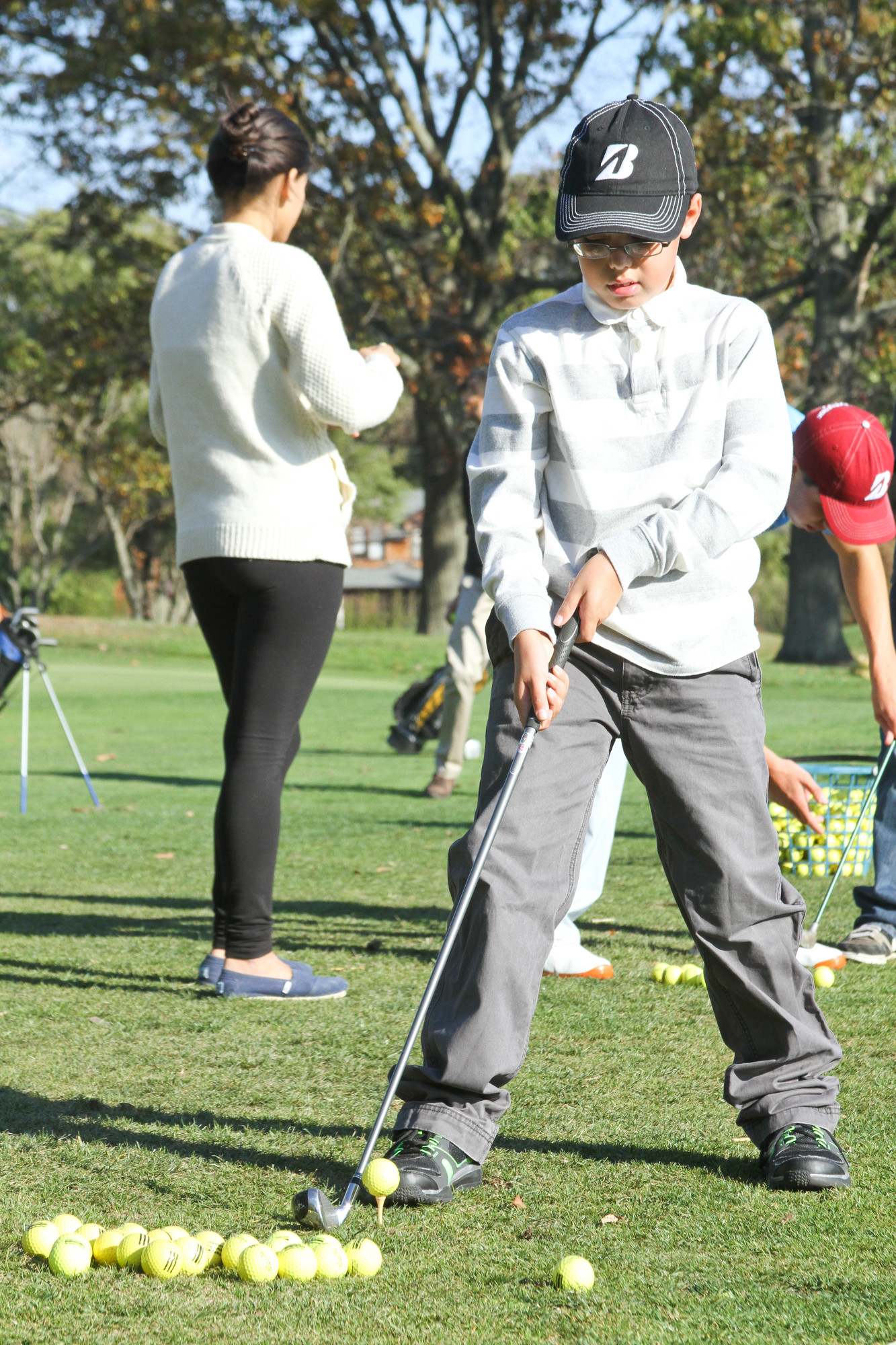 Cristian Cardace, 11, lined up his shot on the Lawrence Yacht & Country Club golf course.