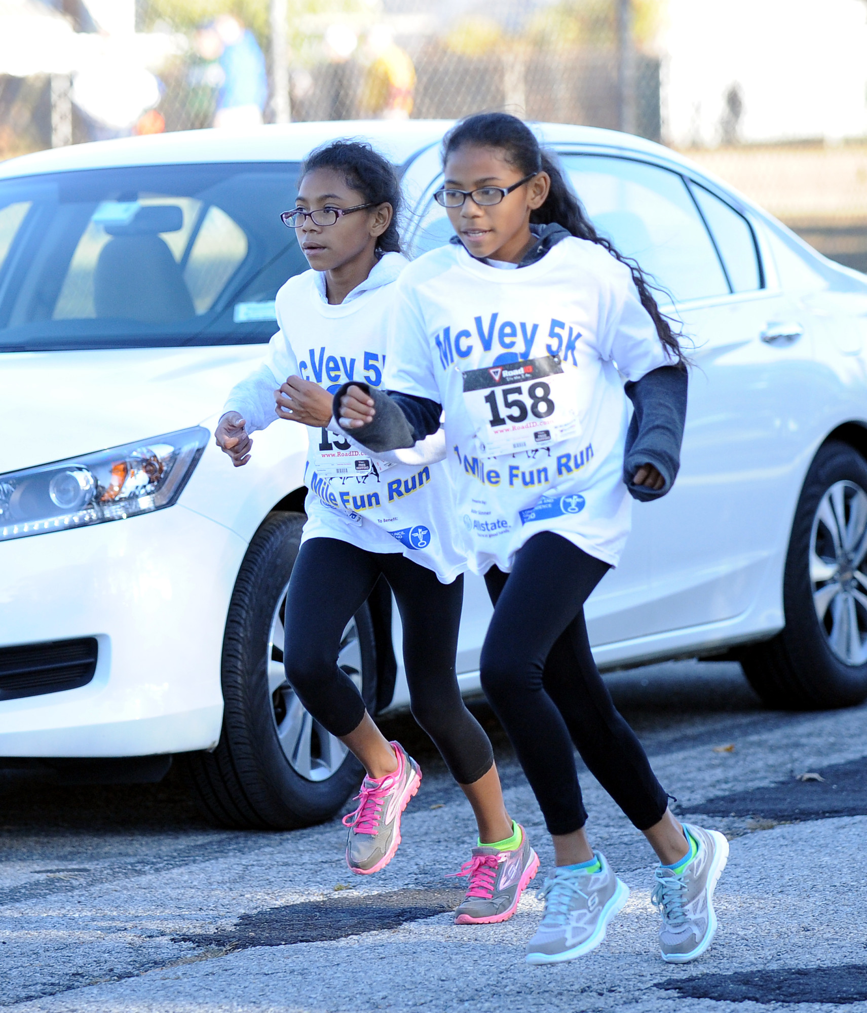 12-year-old twin sisters Isabel and Katherine Marsh ran the entire 5K race side by side.