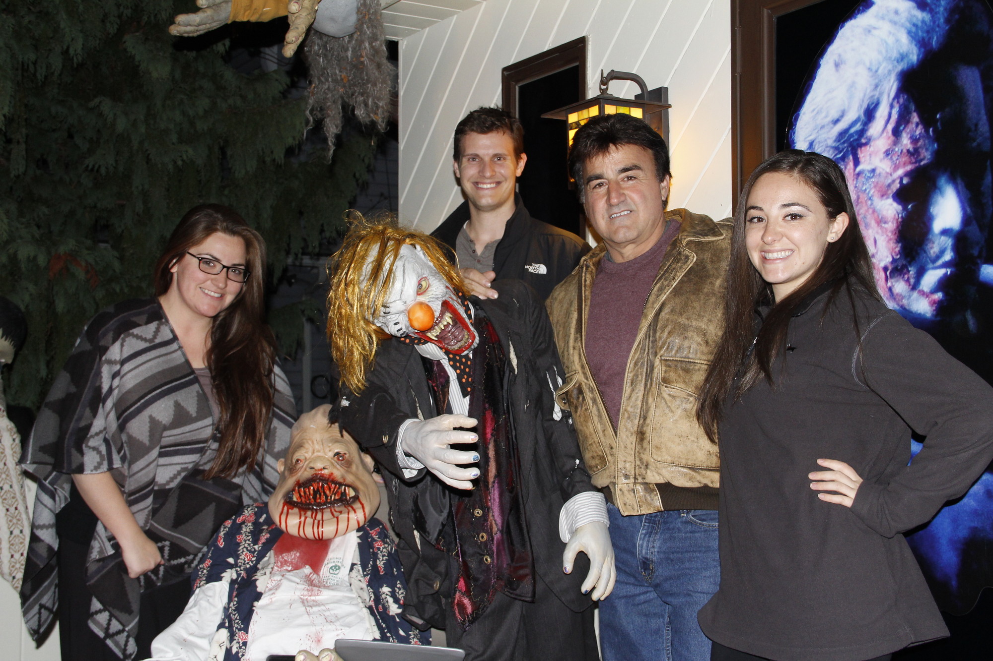 Nicole Gilardi, left, Ryan Franzese and Pat and Allison Gilardi were calm in the presence of two ghouls. The Gilardi family was well-known for their Halloween 
displays when they lived in Rockville Centre and have now resurrected the 
tradition at their new home in Baldwin.