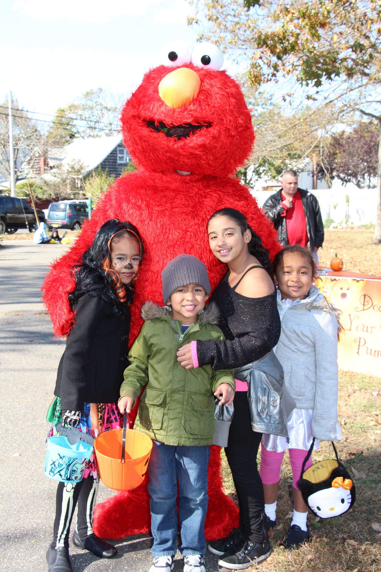Elmo made a stop at the Baldwin Halloween fest where he met Mia, left, Sebastian, Jyliana and Isabella.