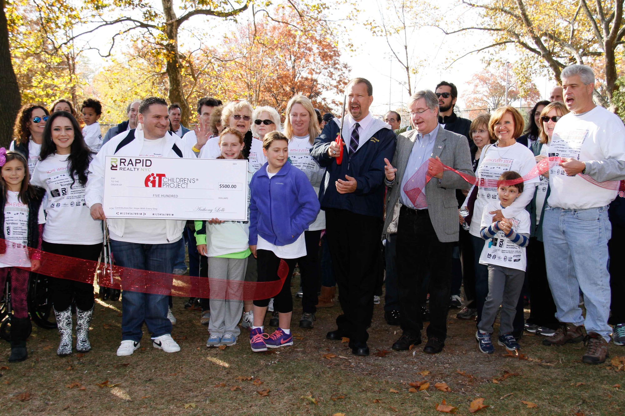 Mayor Ed Fare, along with Village Justice BobBogle, cut the ribbon to kick off the third annual Hope With Every Step fundraiser at Hendrickson Park on Nov. 2.