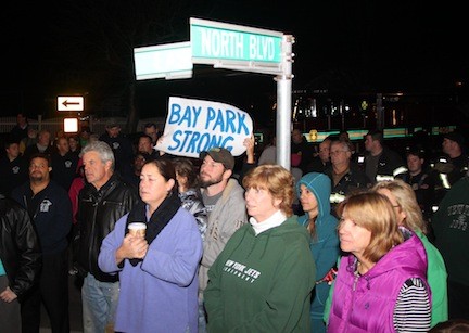Bay Park and East Rockaway residents, along with their supporters, lined the Grand Canal in Bay Park on Oct. 29 to commemorate the first anniversary of Superstorm Sandy.