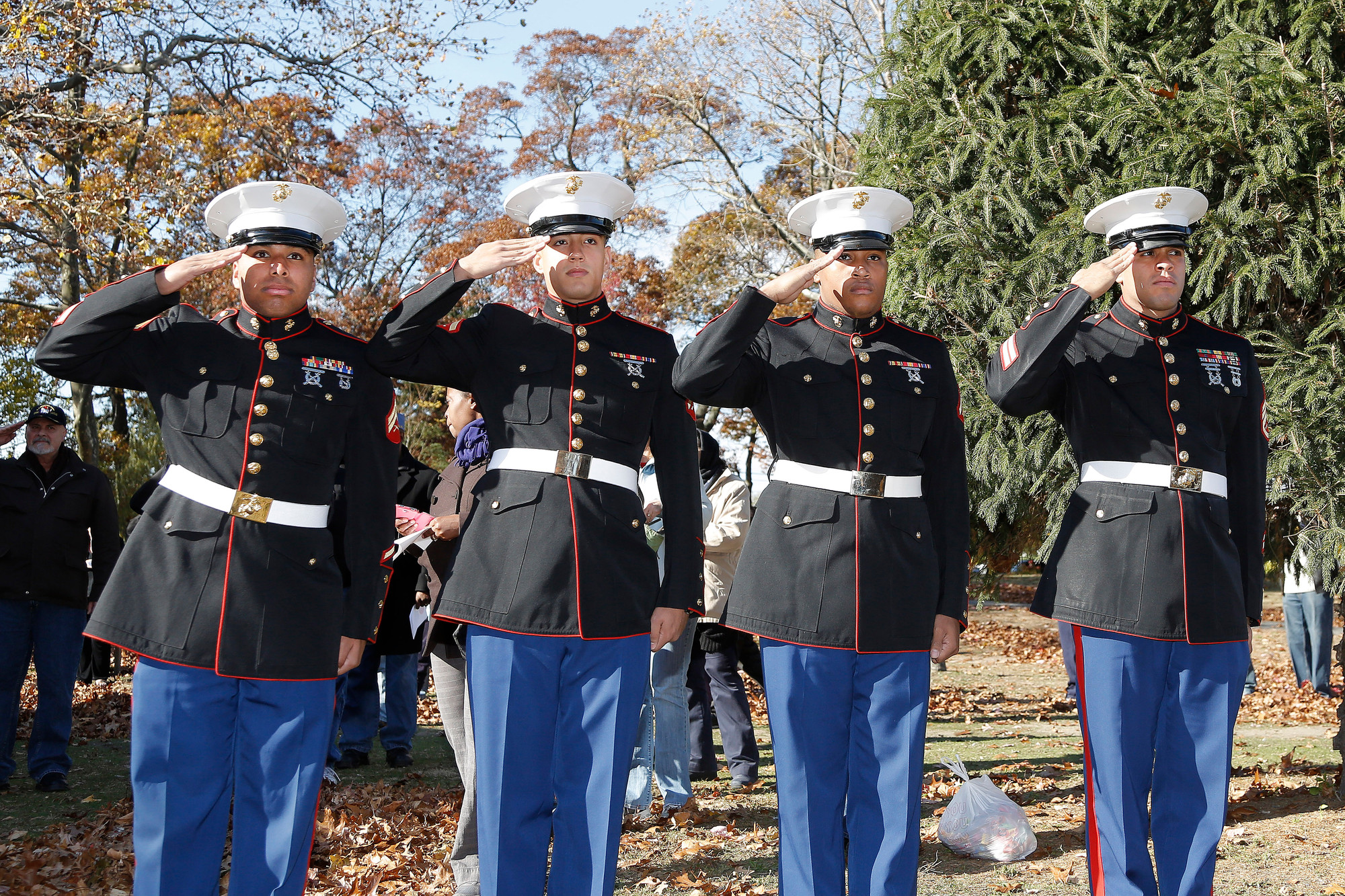 Members of the U.S. Marine Corps saluted as the village