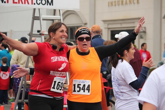 Kristina Gozaloff, left, and Alicia Delano of Selden celebrated their completion of the 10k.