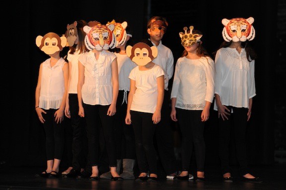 Minimalistic costumes were used to create the menagerie ensemble needed for numbers from The Lion King.