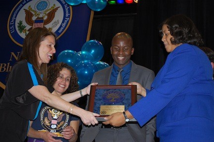 Shaw Avenue School Principal Amy Pernick, left, accepted the Blue Ribbon excellence award from Assemblywoman Michaelle Solages at a ceremony on Nov. 20 at the school. Joining them are District 30 Board President Carolyn Torres and Assistant Principal Josh McPherson.