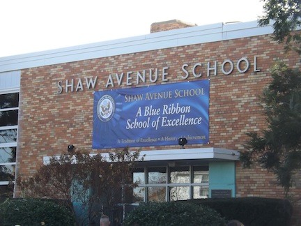 The Blue Ribbon banner 
now hangs above the main entrance of the school for everyone in Valley Stream to see.