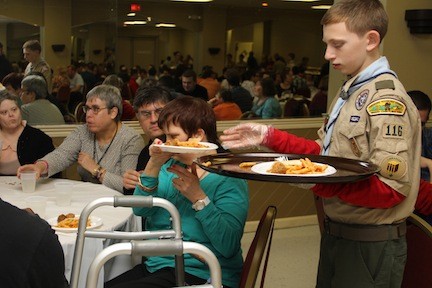 Jason Bitetto of Boy Scout Troop 116 helped serve dinner to the guests.