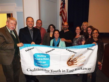 Brian Croce/Herald
Coaltion for youth in East Rockaway members helped organize a presentation on drug abuse on Nov. 20, which was led by Kristen Fexas, fourth from left, of the Nassau County district attorney’s office. ERHS Principal Joe Spero, second from left, is pictured with CYER members and Board of Education Trustee Neil Schloth, third from left, and Superintendent Lisa Ruiz, third from right.