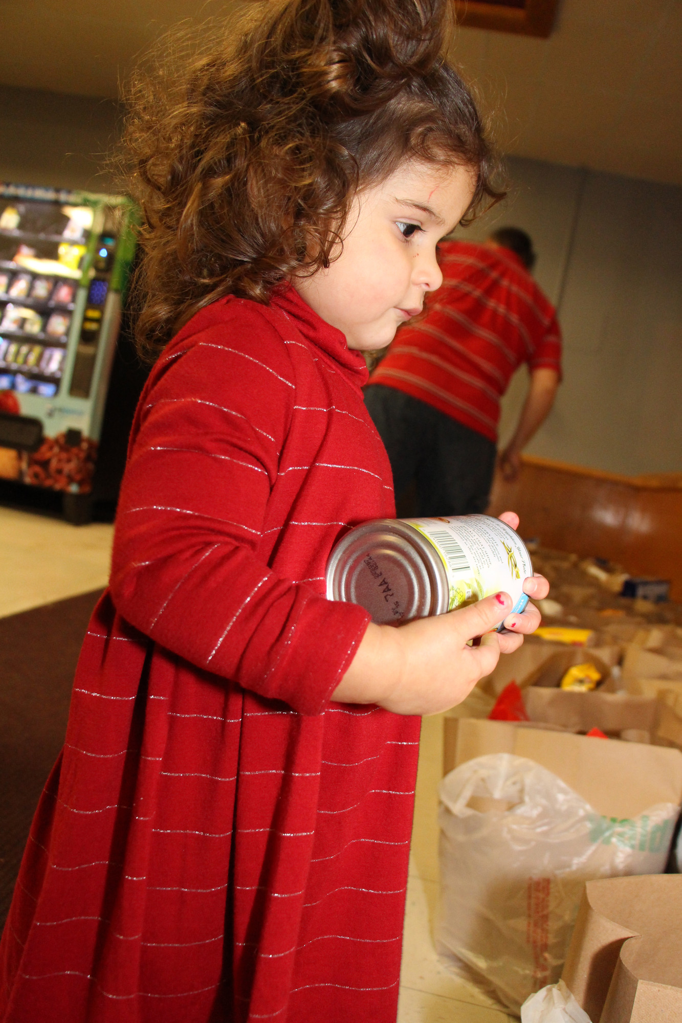 2-year-old Giulianna Sacco, a future Clarke student, learned about volunteering and helping the community.